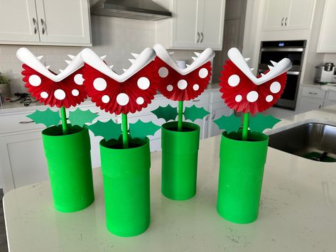 How To Make Super Mario Decorations, Mario Flower Diy, Diy Mario Centerpieces, Goomba Decoration, Pirana Plant Mario, Super Mario Birthday Party Centerpiece, Mario Kart Gender Reveal, Mario Warp Pipe Diy, Diy Mario Tube