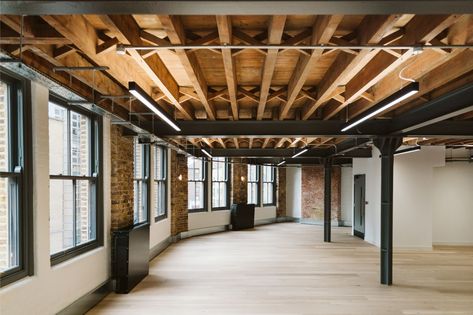 The exposed beams dictated the size and position of the office lighting in 34-38 Provost Street. The original Victorian part of the building features the exposed wooden beams and these have been retained throughout and turned into a design feature.   https://www.299lighting.co.uk/projects/office-lighting-for-a-contemporary-cata-fitout  #exposedbeams #officelighting #lightingdesign #workplacedesign #thelightengineers Exposed Timber Ceiling, Lighting Exposed Beams, Exposed Ceiling Lighting, Rustic Office Design, Beams Ceiling, Exposed Beams Ceiling, Recess Lighting, Office Lighting Design, Nyc Loft