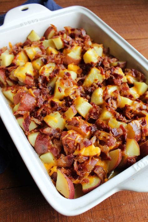 Loaded with cheese and bacon, these potatoes are going to disappear before you even know what happened! Great for BBQs, potlucks or family dinners! Potatoes Bacon And Cheese In Oven, Twice Baked Potato Casserole With Bacon, Baked Potatoes Casserole In The Oven, Cheese And Bacon Potatoes, Potato Wedges With Cheese And Bacon, Potato Bacon Cheese Casserole, Loaded Diced Potatoes, Potato Recipes With Bacon, Bacon Cheese Potatoes Oven