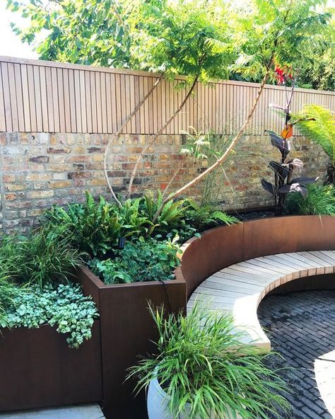 Garden Club London Landscapers on Instagram: "A calm and curvy corner in North London designed by Nadia. 💫 🪴 . . . #gardenclublondon #gardendesign #garden #gardens #bench #curvedbench #green #urbangarden" Curved Bench, Steel Flowers, London Clubs, Garden Club, North London, London Design, Urban Garden, Small Garden, Flower Beds