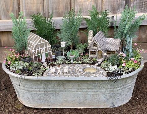 Creating a miniature fairy garden on the small vintage baby bath will add a whimsical touch to your outdoor space. Incorporating tiny furniture, plants, and fairy figurines will bring the garden to life in a charming way. Miniature fairy garden from @minifairygarden Fairy Garden Set Up Ideas, Cottagecore Fairy Garden, Fairy Garden Plant Pot, Fairy Garden Planter Ideas, Fairy Garden Ideas Indoor, Fairy Garden Container Ideas, Dollar Tree Fairy Garden, Fairy Garden Ideas Outdoor, Fairy Garden In A Pot