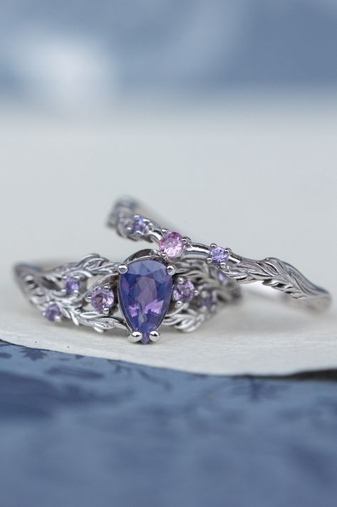 Nature inspired opalescent purple sapphire engagement ring, gold vines and leaves ring with sapphires Shop this style with different options: Japanese Maple This listing is for engagement ring only! Complete opalescent sapphire bridal ring set is available here. Delicately sculpted this leaves ring set would be perfect for alternative engagement ring set seekers. You can see Japanese maple leaves wrapping the central gemstone - natural purple sapphire. Sparkling sapphires are scattered between g Purple Sapphire Ring Engagement, Wedding Rings Engagement Amethyst, Wedding Ring Amethyst, Rings Purple, Unique Engagement Rings Purple, Rings Engagement Purple, Ring Purple, Engagement Ring Purple, Wedding Rings Purple