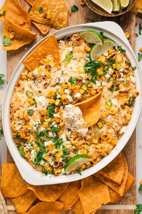 Hot Mexican Street Corn Dip has the flavors of Elote in a creamy, cheesy dip made with roasted corn. Grab the tortilla chips and get dipping! Elote Dip Crockpot, Chicken Corn Dip, Hot Mexican Street Corn Dip, Hot Mexican Street Corn, Creamy Corn Dip, Corn In The Oven, Mexican Corn Dip, Street Corn Dip, Mexican Street Corn Dip