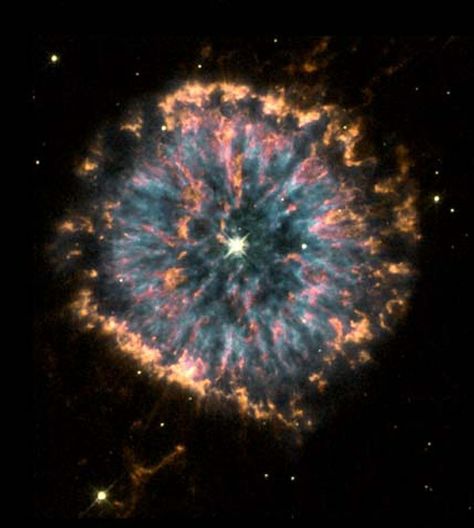 The strikingly unusual planetary nebula,   NGC 6751.  Glowing in the constellation Aquila like a giant eye, the nebula is a   cloud of gas ejected several thousand years ago from the hot star visible in its   center. Carl Sagan Cosmos, Cer Nocturn, Planetary Nebula, Nasa Hubble, Hubble Telescope, Hubble Images, Hubble Space, Space Photos, Space Images