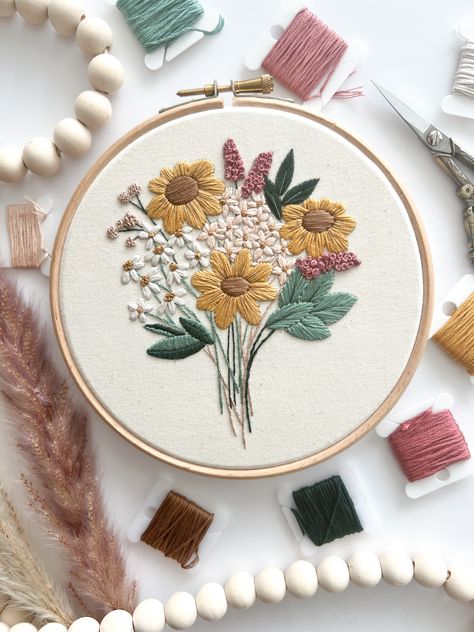 Pink floral wildflower bouquet. Modern hand embroidery pattern that’s beginner friendly. Brand new embroidery book with 18 patterns to embroider.