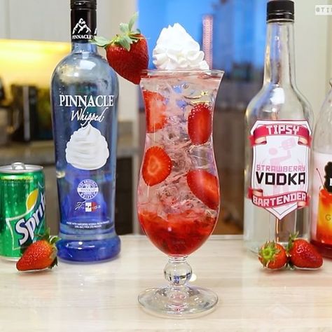 STRAWBERRY AND CREAM COCKTAIL  1 oz. (30ml) Strawberry Vodka 1 oz. (30ml) Whipped Cream Vodka 1 oz. (30ml) Grenadine Soda Water Strawberry Slices Whipped Cream  PREPARATION 1. In a glass with ice, combine strawberry vodka and whipped cream vodka. Shake well. 2. In a tall glass, pour in Grenadine syrup and gently drop in some ice. 3. Insert strawberry slices between ice cubes and strain mix into the glass. Top with soda water. 4. Add whipped cream and garnish with a strawberry. Enjoy respon... Drinks With Whipped Cream Vodka, Smirnoff Strawberry Vodka Drinks, Vodka Soaked Strawberries, Tipsy Bartender Recipes, Frozen Strawberry Lemonade Vodka, Tito’s Strawberry Lemonade, Vodka Mixed Drinks, Whipped Vodka, Jello Shot