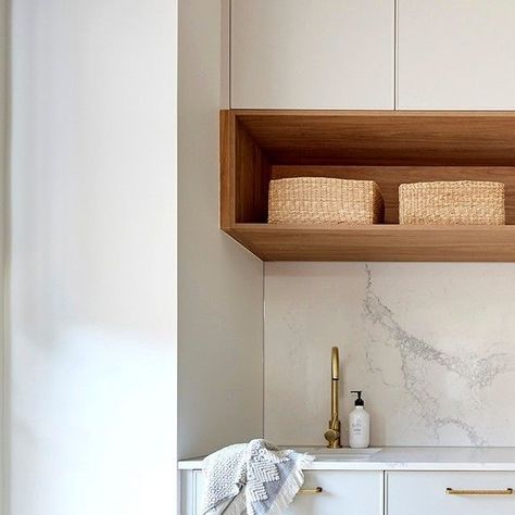 Oliveri on Instagram: "Offering the perfect balance of style and functionality. This palette includes warm timber, marble and brass creating a luxurious coastal feel and ample storage and bench space.   Get the look with our Santorini sink and Vilo tap. Explore the full range at http://oliveri.com.au Link in the bio.   Laundry design by @kinsmangroup  #laundry #design #interiordesign #tapware #sink #coastal #coastallaundry" Marble And Brass, Laundry Design, Marble Wood, Santorini, Get The Look, West Coast, Modern House, Tap, Bench