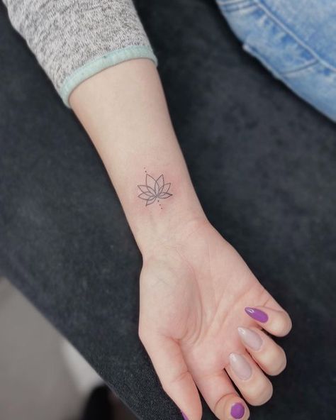 33 Lotus Flower Tattoo Ideas😊#tattoo #tattooideas #tatouagecuissefemme #tattoominimalist #backtattoo #tattoosforwomen #tattoomain #minitats Lotus Rebirth Tattoo, Lotus North Star Tattoo, Lotus Flower Heart Tattoo, Lotus Flower Tattoo Wrist For Women, Micro Lotus Tattoo, Symbolic Flower Tattoos, Lotus Flower I Am Enough Tattoo, Still I Rise Lotus Tattoo, Tattoos For Rebirth