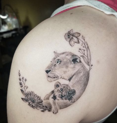 200+ Powerful Lion Tattoo Ideas With Meanings and History - Tattoo Stylist Mom Lion Tattoo, Baby Cub Tattoo, Mother Son Lion Tattoo, Lioness Shoulder Tattoo For Women, Lioness Cub Tattoo, Lioness With Cubs Tattoo, Lioness And Cubs Tattoo For Women, Lion With Cubs Tattoo, Mother And Daughter Lion Tattoos