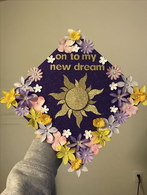 Tangled theme- college grad cap Cap College Decoration, University Cap Decoration, Grad Cap Designs Tangled, Tangle Graduation Cap, Graduation Cap Rapunzel, Pride And Prejudice Graduation Cap, Simple Cute Grad Caps, Cap Decoration Ideas High School, Fun Grad Cap Ideas