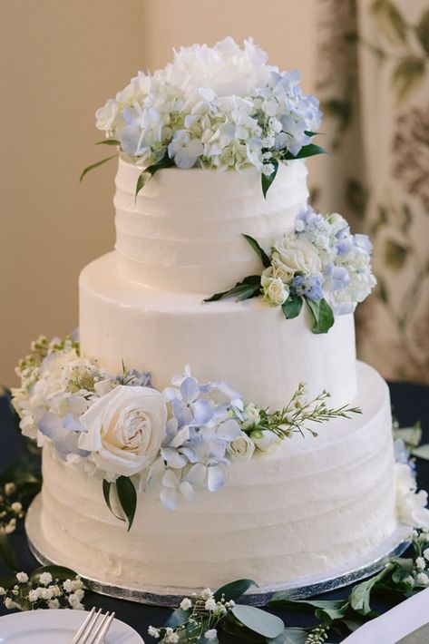 Classic Cake Wedding, Yellow Blue Wedding Cake, Wedding Cakes With Blue Accents, Wedding Dessert Table Flowers, Whimsical Classic Wedding, Dusty Blue And White Wedding Cake, Wedding Cake Frosting Design, Wedding Cake Inspo Elegant, White And Light Blue Wedding Cake