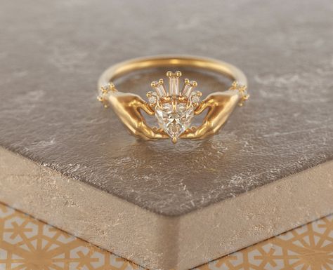 Exquisite and delicate Claddagh ring with Moissanite heart and baguette diamonds crown. Traditional Irish promise ring, a beautiful symbol of love (heart), friendship (hands) and loyalty (crown). The modernized design of this ring makes it a perfect heirloom piece of our days, that will become your real heritage. About this item: -Moissanite (~0,5ct) and diamonds G-H color.Total carat weight ~ 0.55 -Heart stone can be customized, please feel free to write to me for variations. -Solid 10K Rose, Y