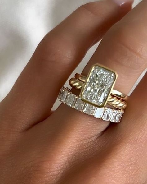 GOODSTONE on Instagram: "To bezel or not to bezel? That is the question.✨  Embrace secure elegance and timeless style with a bezel-set engagement ring. Crafted for durability while highlighting your gemstone’s brilliance, this sleek design combines protection with sophistication.💍  Whether you opt for a full bezel, a half bezel, or no bezel at all, the radiant cut shines beautifully, leaving you to decide which setting best complements your love story.💎 Share this with you bestie who is radiant cut obsessed just like us ✨  #bezelsetting #bezelset #engagementring #radiantcut" Radiant Bezel Ring, Bezel Set Radiant Cut Engagement Ring, Bezel Radiant Engagement Ring, Radiant Bezel Engagement Ring, Cool Girl Engagement Rings, Half Bezel Engagement Ring, Bezel Set Wedding Ring, Bezel Set Diamond Ring, Stacked Engagement Ring