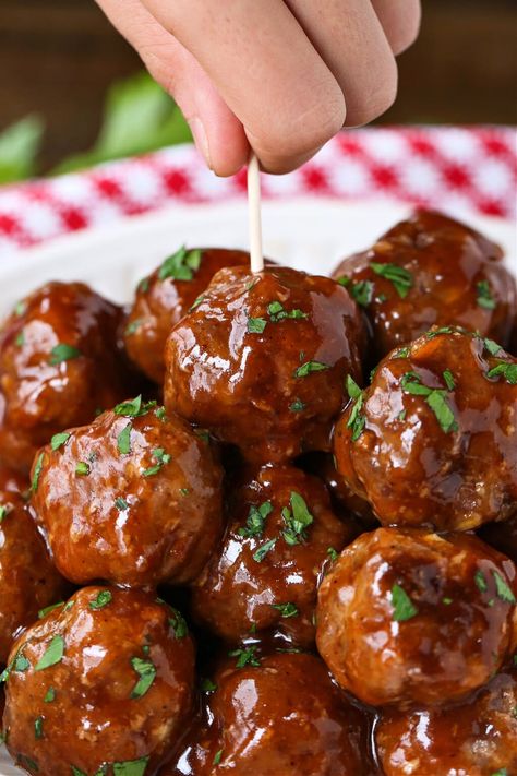 BBQ Party Meatballs are one of our favorite party appetizers! Homemade meatballs that are oven baked and tossed in a sweet and spicy sauce. Bbq Meatball Sliders, Meatball Skewers Appetizers, Bbq Meatballs Baked In Oven, Homemade Bbq Meatballs, Easy Cocktail Meatballs, Easy Bbq Meatballs, Barbecue Meatball Recipes, Meatballs Sauce Recipe, Party Food Meatballs