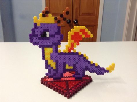 Spyro the Dragon- Hama Bead Stand by Dogtorwho on DeviantArt Perler Designs, Pony Bead Crafts, Graph Patterns, Hamma Beads, Art Perle, Spyro The Dragon, Hama Bead, Diy Perler Bead Crafts, Hama Beads Patterns