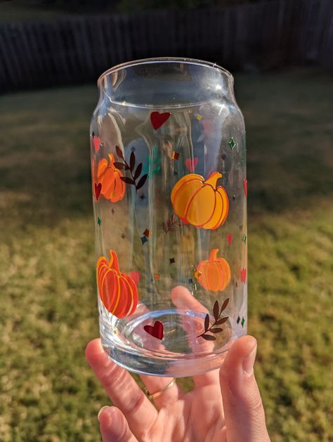 Fall Harvest 16 oz beer can shaped glass made with premium permanent vinyl!  It has layered pumpkins, leaves and heart on it.  This glass is made with premium permanent vinyl.  This glass is absolutely beautiful and perfect for fall.  These are perfect as gifts or for yourself this fall season! **CARE INSTRUCTIONS - hand wash only gently with soap. Allow glass to air dry fully. **SHIPPING INFORMATION - please allow 1-3 business days for fulfillment plus shipping confirmation.  Any questions abou Wine Glass Fall Crafts, Fall Painted Clay Pots, Fall Diy Wine Glasses, Glass Painting Autumn, Fall Glass Painting Ideas, Autumn Glass Painting, Fall Wine Glass Painting Ideas, Halloween Glass Painting, Fall Wine Glass Painting