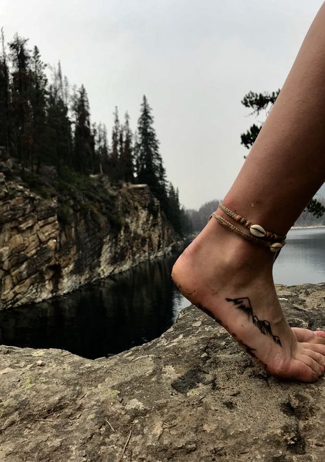 Cave Tattoo Women, Outdoorsy Tattoos Nature Women, Nature Ankle Tattoo, Petoskey Stone Tattoo, Environmentalist Tattoo, Mountain Foot Tattoo, Mountain Tattoo Ankle, Earthy Tattoos Nature Simple, Matching Nature Tattoos