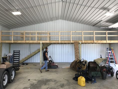 Pole barn loft. Hidden stairs. 6.5 ft x 42 ft. Storage above and below Metal Building Organization Garage, Storage Ideas For Metal Building, Loft In Garage Ideas, Garage Mezzanine Storage, Loft In Shop Ideas, Shed Mezzanine Ideas, Garage Mezzanine Ideas, Loft In Garage, Pole Barn Garage Interior