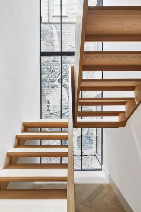 2/3 View from the bottom of the new basement staircase, illuminated by a two-storey lightwell. #MulroyArchitects #Architecture #London #DukesAvenue http://www.mulroyarchitects.com Staircase Extension, Stairs In Front Of Window, Staircase Narrow, Double Staircase Modern, Double Hight Stairs Design, Central Stringer Staircase, Contemporary Oak Stairs, Glass Oak Staircase, Staircase Window