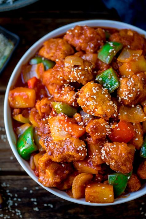 Homemade crispy sweet and sour chicken with a better-than-takeout sauce made from store cupboard ingredients! Ready in 25 minutes. #sweetandsour #sweetandsourchicken #chinese #chinesechicken #betterthantakeout #fakeaway #streetfood Lo Mein Recipes, Store Cupboard, Sweet And Sour Chicken, Sweet Sour Chicken, Sweet N Sour Chicken, Sweet And Sour Sauce, Crispy Onions, Amish Recipes, Interesting Food