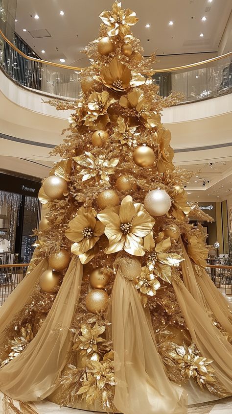 Luxurious gold Christmas tree with golden flowers and ornaments in an elegant shopping mall, creating a festive holiday Gold White And Silver Christmas Trees, Gold Metal Christmas Tree, All Gold Christmas Tree, Floral Christmas Tree Ideas, Gold Christmas Tree Decorations Ideas, Gold Theme Christmas Tree, Gold Flocked Christmas Tree, Magnolia Christmas Tree, Gold Silver Christmas Tree