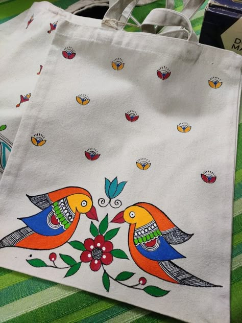 This totebags is having hand painted Madhubani art motifs. A folk art form from India. Fabric Painting On Bags, Canvas Pouch Painting Ideas, Handpainted Pouches, Tote Bag Painting Ideas Easy, Easy Tote Bag Painting, Tote Bags Painting, Pouch Painting, Diy Fabric Purses, Painted Canvas Tote