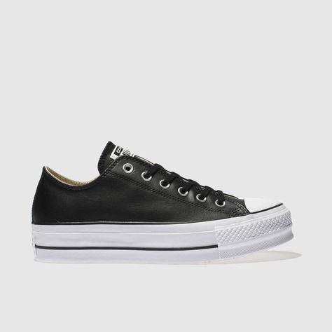 Lifting your new season style, the Chuck Taylor Lift Ox platform arrives from Converse. The black leather upper is home to iconic eyelet detailing which gives a timeless look. A 3cm platform vulcanised sole finishes this chic trainer in style. UPPER: Leather,LINING: Fabric,OUTSOLE: White Spider Rubber,PLATFORM: 3cmcolour : Black Product code : 1924717020 Black Leather Converse, Black Chuck Taylors, Styling Chelsea Boots, Black Chucks, Classic Branding, White Spider, Leather Converse, Womens Footwear, Animal Print Shoes