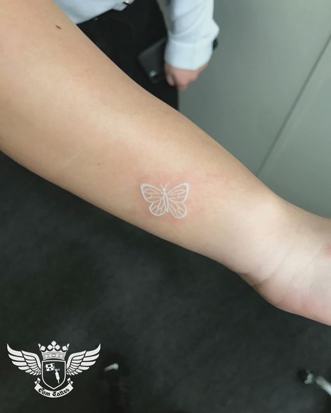 nice 25 Aesthetic White Tattoos White Butterfly Tatoos, White Ink Tattoo Butterfly, Small White Butterfly Tattoo, Butterfly Tattoo White, White Ink Butterfly Tattoo, White Finger Tattoos, Feminine Wrist Tattoos, White Butterfly Tattoo, Tattoos Feminine