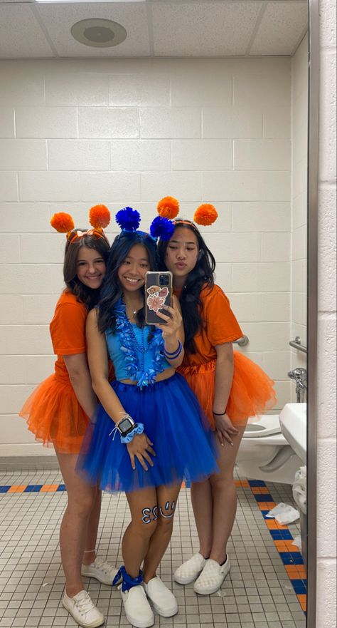 school spirit week, orange school spirit, blue school spirit, friday night lights football, color wars, color tutus, pom pom head bands, mirror picture #schoolspirit #blueout #orangeout #fridaynightlights #football #tutu Orange And Blue Spirit Day Ideas, Orange And Blue Football Outfit, Blue Color Wars Outfit, Blue And Gold School Spirit Outfit, Class Color Day Spirit Week Outfits, School Pride Outfit Ideas, Orange Team Spirit Ideas, School Spirit Day Outfits, Class Color Day Spirit Week Blue