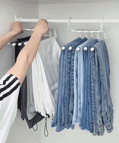 https://media.giphy.com/media/WZA6Aq5LgeEXRUhKUD/giphy.gif Tie Storage, Magic Clothes, Trouser Hangers, Pants Rack, Scarf Hanger, Space Saving Hangers, Wrinkled Clothes, Closet Shelf Organization, Hanger Organizer