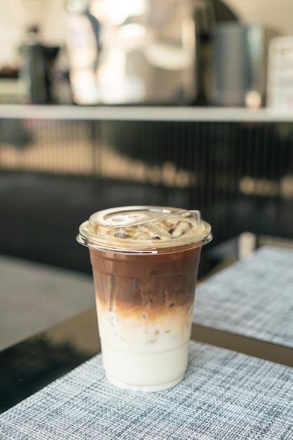 Ice Latte Aesthetic, Ice In A Cup, Ice Coffee Aesthetic, Aesthetic Cafe Food, Iced Latte Aesthetic, Cup On Table, Coffee Macchiato, Cold Coffee Cup, Coffee Shop Tables