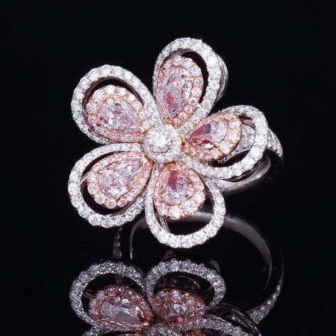 Chic, Fun, and simple. This Fancy Pink Flower Ring is a one of a kind design perfect for any women. 5 matching light pink pear shape diamond surrounded by a pink diamond halo and white rounds. Available to ship in 3-4 weeks. Pink Diamond Wedding Rings, Fancy Pink Diamond Ring, Pink Flower Ring, Pink Diamond Jewelry, Diamond Flower Ring, Flower Diamond Ring, High Jewelry Ring, Pink Diamond Ring, Expensive Jewelry Luxury