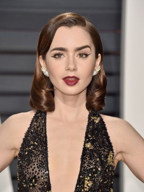 While we admittedly wish we got to see two looks from Lily last night, this one surely brought out all the stops. Sophisticated and sweet, yet still edgy and interesting, Lily mastered yet another makeup look we'll be copying, stat. Lily Collins Hairstyles, Old Hollywood Curls, 2 Braids Hairstyles, Sophisticated Makeup, Hollywood Curls, Kim Kardashian Hair, Shaved Side Hairstyles, Hairstyle Names, Oscars Party