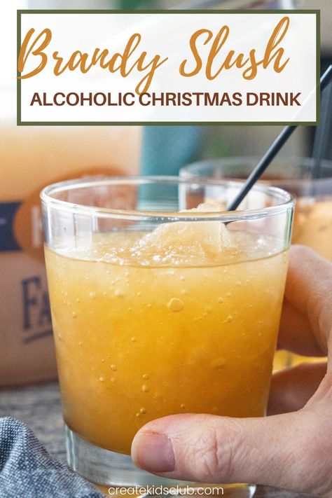 Brandy Slush is an alcoholic drink recipe made at Thanksgiving and Christmas in the midwest. It's a delicious slush recipe made in an ice cream pail - perfect for transporting! #brandyslush #brandyslushrecipe #thanksgivingdrinkrecipes #alcoholicdrinkrecipes #alcoholicchristmasdrinkrecipes #createkidsclub Brandy Slush Recipe Without Tea, Brandy Slush Wisconsin, Brandy Slush Recipe Wisconsin, Apricot Brandy Slush, Holiday Slush Recipes, Christmas Slush Recipes, Brandy Drink Recipes, Whiskey Slush Recipe, Brandy Slush Recipe