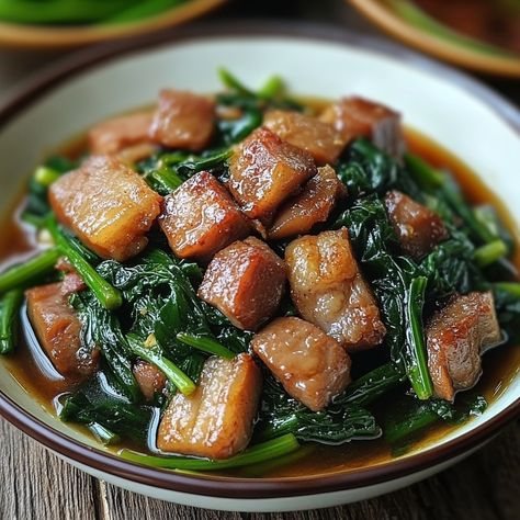 🌿🔥 Discover the unique twist of Adobong Kangkong—water spinach in a savory adobo sauce that's sure to impress! 😋 #AdobongKangkong #FilipinoVeggies Adobong Kangkong (Water Spinach Adobo) Ingredients: Water spinach (1 bunch, trimmed) Pork belly (200g, cubed) Garlic (4 cloves, minced) Onion (1, chopped) Soy sauce (2 tbsp) Vinegar (3 tbsp) Bay leaves (2) Water (1 cup) Salt and pepper (to taste) Instructions: Sauté garlic and onion until fragrant. Add pork belly and cook until browned. Stir in... Adobo Ingredients, Adobong Kangkong, Cozy Fall Recipes, Water Spinach, Instagram Recipes, Adobo Sauce, Festive Drinks, Trending Recipes, Minced Onion