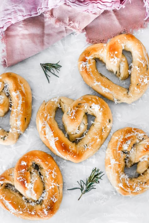 These Heart-Shaped Sea Salt Rosemary Pretzels are perfect for Valentine’s Day as they are soft, salty, and oh so yummy! | Heart-Shaped Sea Salt Rosemary Pretzels - Domestically Blissful | Valentine's Day. | Heart - Shaped Pretzels for Valentine's Day. | Rosemary and Sea Salt Pretzels. | Delicious Twist to Regular Pretzels. | Heart Shaped Savory Treat. | Valentine's Day Baked Treat. | Easy Soft Pretzel Recipe. | Valentine's Day Recipe. | Rosemary, Sea Salt, Pretzel's with a Sprinkle of Parmesan Valentines Gift Basket, Valentines Party Food, Valentines Recipes, Valentines Snacks, Valentines Dinner, Homemade Pretzels, Valentines Baking, Pretzels Recipe, Valentine Dinner