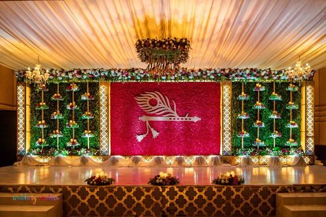 Photo By Wedding Chakra - Decorators Ganapati Stage Decoration Ideas, Tilak Function Decoration, Stage Decorations For Naming Ceremony, Tilak Stage Decoration, Bhagwat Katha Stage Decoration, Dhoti Ceremony Decorations, Dhoti Function Decoration, Flute And Feather, Naamkaran Decoration Ideas