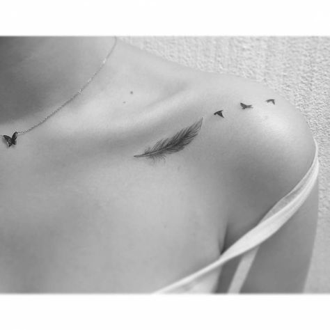 Feather and flying birds tattoo located on the Bird Tattoo Collarbone, Feather Bird Tattoo Shoulder, Bird Tattoo Neck, Small Bird Tattoos, Feather With Birds Tattoo, Bird Tattoo Meaning, Small Bird Tattoo, Tato Henna, Bone Tattoos