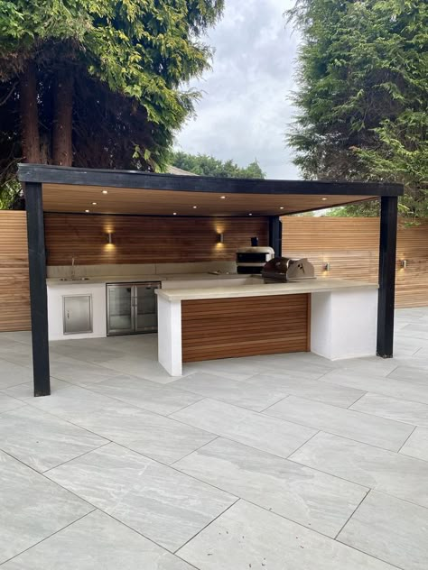 On the hunt for outdoor ideas to transform your garden design? How about upgrading your outdoor living space with a luxury outdoor kitchen! 🥂 This u-shaped outdoor kitchen design, complete with a softwood shelter, storage and top tier outdoor cooking appliances, makes the perfect garden kitchen for hosting garden parties and otudoor gatherings with family and friends. 🏡 For more outdoor kitchen ideas, visit our feed. 👀 Or, for more information on our outdoor kitchens, contact us today 📲 House Backyard Ideas, Barbeque Design, Indoor Outdoor Living Room, Luxury Outdoor Living, Luxury Outdoor Kitchen, Modular Outdoor Kitchens, Outdoor Barbeque, Modern Coastal Decor, Outdoor Kitchen Ideas