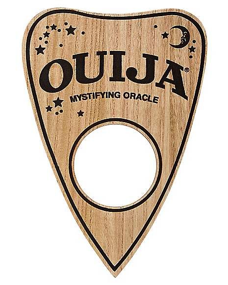 Ouija Board Planchette Sign - Spirithalloween.com Ouija Board Planchette, Ouija Planchette, Horror Gifts, Spencers Gifts, Halloween Front Porch, Skateboard Design, Ouija Board, Victorian Steampunk, Halloween Home Decor