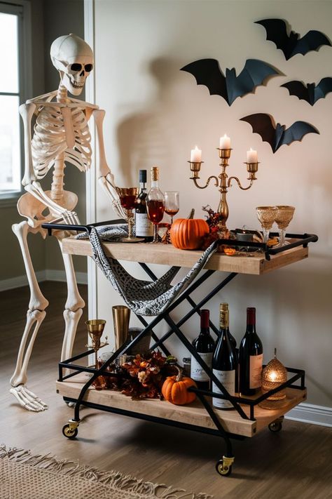 A skeleton pushing a bar cart in a modern farmhouse setting, offering a unique Halloween bar cart idea with spooky vibes Bar Table Ideas Parties, Birthday Bar Cart, Halloween Bar Setup, Corner Bar Cart, Bar Halloween Decor, Office Bar Cart, Goth Bar Cart, Outdoor Bar Cart Ideas, Bar Cart Area