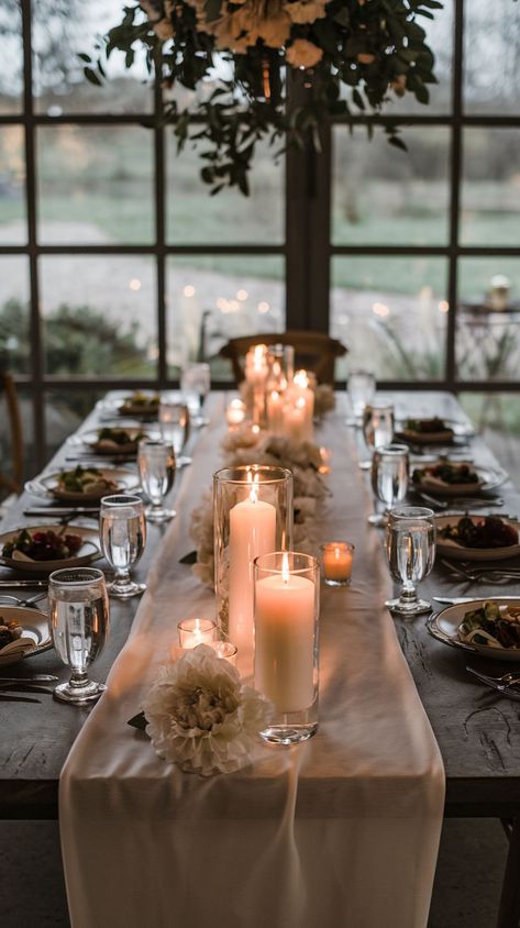 A farmhouse style wedding table. Brass Centerpiece Wedding, Wedding Lots Of Candles, Intimate Wedding Dinner Table, Wedding Harvest Table Decor, Tall Greenery Centerpieces, Wedding Centerpieces Without Flowers, Candle Tablescapes Wedding, Simple Candle Centerpieces Wedding, Winter Wedding Centerpiece Ideas