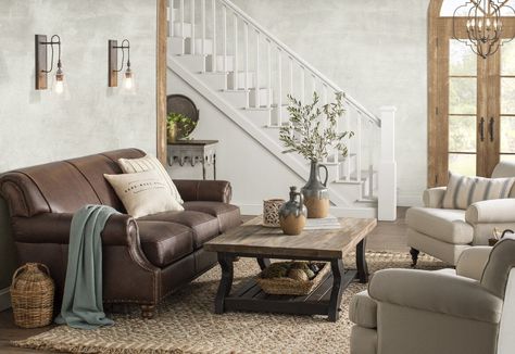 The classic dark brown leather sofa has served as a stereotypical focal point in the living room for decades. If not properly designed and utilized, l... | White And Sage Green  #DarkBrownLeatherSofa #DarkBrownLeatherSofaDecorating #LeatherSofa #BrownLeatherSofa Dark Brown Sofa Living Room, Brown Leather Sofa Decor, Dark Leather Couches, Leather Sofa Decor, Dark Brown Leather Sofa, Leather Couch Living Room Decor, Brown Leather Couch Living Room, Brown Leather Furniture, Dark Brown Sofas