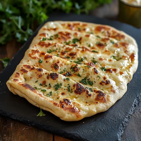 🍞 Plain and Cheese Naans: The Soft and Delicious Indian Flatbread You'll Love! 🧀 Ingredients: - 300 g flour - 1 teaspoon sugar - 1 teaspoon salt - 1/2 sachet baking powder - 1 plain yogurt (about 125 g) - 2 tablespoons olive oil - 100 ml warm water - 100 g grated cheese (mozzarella or emmental type) - A little melted butter for cooking Preparation: In a large bowl, mix the flour, sugar, salt and baking powder. Then add the plain yogurt and olive oil. Mix well to obtain a sandy dough. Gradual... Indian Flatbread, Cheese Mozzarella, Breads & Buns, Oil Mix, Plain Yogurt, Grated Cheese, Flatbread, Large Bowl, Melted Butter