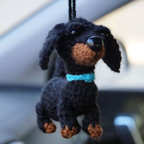 ✨Add a touch of personality, charm and some holiday cheer to your car with this adorable dachshund car mirror decoration! Crafted with attention to detail, this fun decoration is designed to hang from your car’s rearview mirror, instantly elevating the interior with a fun, whimsical vibe. Perfect for dog lovers, especially those who adore the playful and loyal Dachshund breed, this unique accessory brings a little joy to your daily drive.  Whether youre gifting it to a fellow Dachshund enthusiast or treating yourself, its a delightful way to celebrate your love for these lovable pups.Bring a smile to your face and add some flair to your car with this Dachshund Car Mirror Decoration—the perfect little companion for your journeys! Specifications:Materials:  acrylic yarn, fyberfillSize: Wear