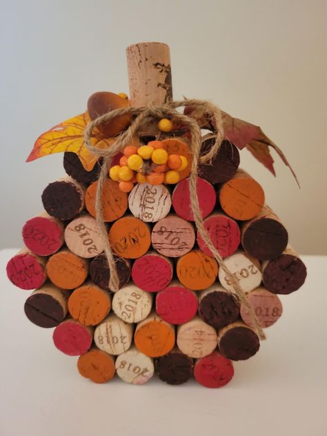 Add a touch of rustic charm to your autumn decor with my handcrafted wine cork pumpkin. Each pumpkin is assembled from reclaimed wine corks, creating a unique and eco-friendly decoration. Hand painted to give that rustic charm. Accented with fall leaves, berries and jute rope bow. Perfect for Thanksgiving table, fall festivals or as a thoughtful  gift. Thanksgiving Cork Crafts, Wine Cork Basket, Wine Cork Star, Wine Cork Pumpkins Diy, Handmade Thanksgiving Decorations, How To Make A Wine Cork Christmas Tree, Wine Cork Pumpkins Fall Crafts, Cork Pumpkins Fall Crafts, Wine Cork Projects Diy