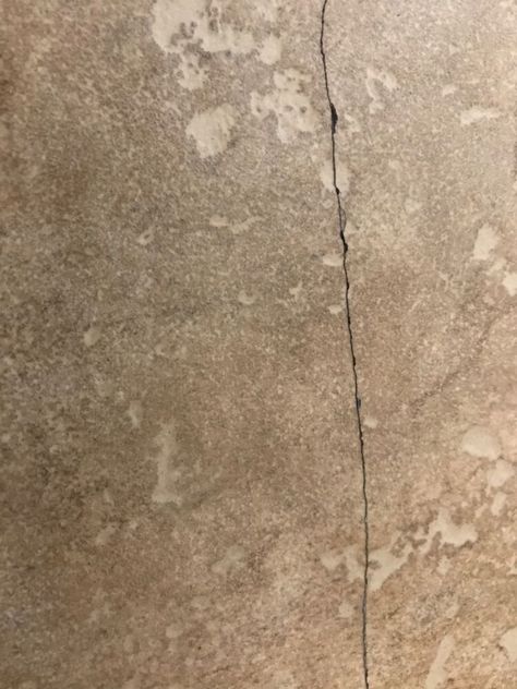 A few of my tiles broke and I wanted to come up with an easy and affordable fix. I came up with this idea and I thought it worked out pretty well, check it out!    I used just a couple of items:  paint  mod podge  brush      The cracks were just a hairline, but it was really bugging me. It was not the right time to change the tiles, so here goes my solution!     Using a paint that is close enough to the tile color as possible, mixed into a small amount of mod podge, I dripped some ont… Cracked Tile Repair, Glass Shower Door Cleaner, Wood Look Tile Floor, Cement Tile Floor, Black Cherry Wood, Tile Repair, Tile Color, Patio Wall, Homemade Decor