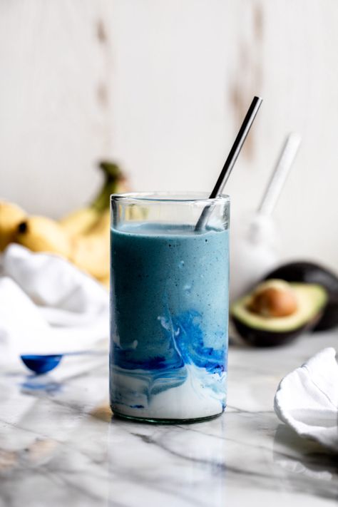 blue smoothie in a glass with coconut cream swirl and straw with banana and avocado in background Coconut Cloud Smoothie, Smoothie Inspiration, Cloud Smoothie, Smoothie With Coconut, Coconut Cloud, Blue Smoothie, Banana Drinks, Coconut Drinks, Yummy Meals