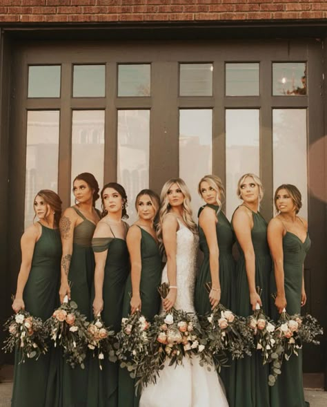 Modern, moody bridesmaids dresses all deep forest green, each a unique style to make each member feel her absolute best! Deep Forest Green Bridesmaid Dresses, Woodland Green Wedding, Deep Green Bridesmaid Dresses Fall, Deep Forest Green Wedding, Deep Green Wedding Decor, Deep Green Wedding Colors, Earthy Green Bridesmaid Dresses, Unique Bridesmaids Dresses, Deep Forest Wedding