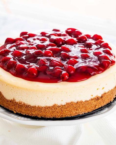 This Cheesecake Recipe is the only recipe you'll ever need for Cheesecake. A dreamy, decadent, rich, smooth and utterly delicious cheesecake topped with cherry topping! This really is what cheesecake dreams are made of! #cheesecake #recipe Cheesecake With Cherries, Juniors Cheesecake Recipe, Cheese Cakes Design, Cheesecake For Birthday, Cherry Cheesecake Recipes, Cheesecake Pictures, Cheesecake Birthday Cake, Cheesecake Aesthetic, Original Cheesecake Recipe